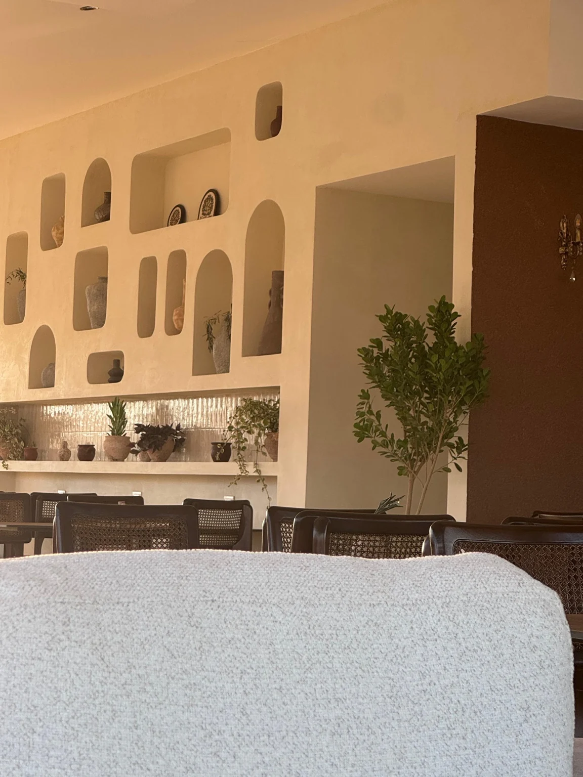 Warm interior details and lounge seating at Saint John Hotel